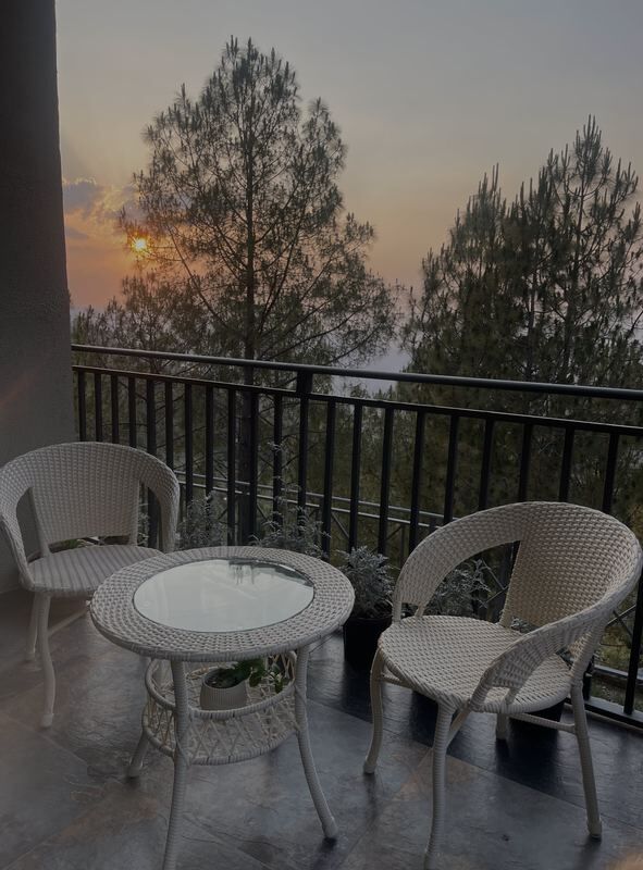 The sit-out at sunset, looking over the Himalayan foothills